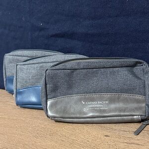 3 Cathay Pacific amenity kit bags